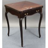 An Edwardian mahogany envelope-top card table inset green baize, fitted frieze drawer, & on carved