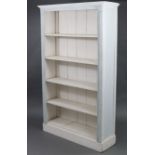 A light grey & white painted five-tier standing tall open bookcase with moulded cornice, having