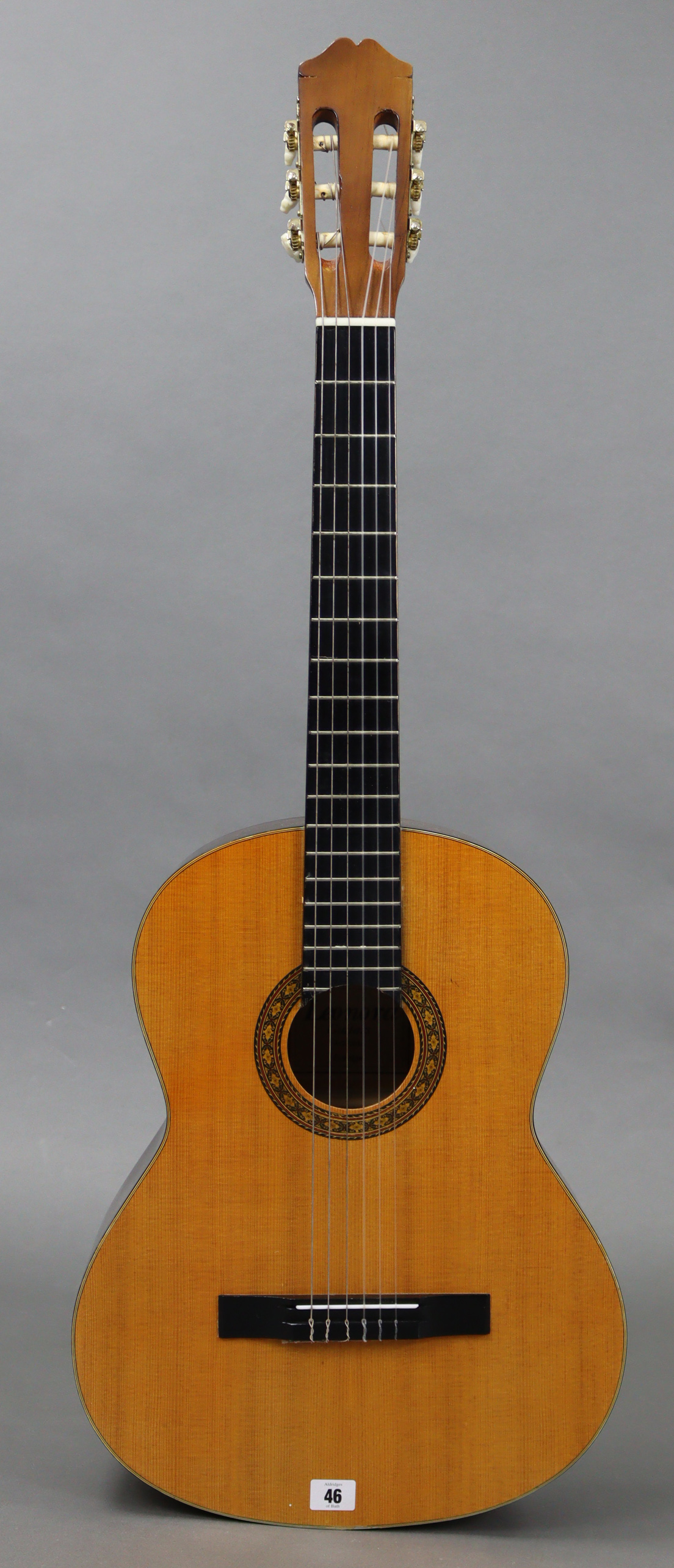 A Leonora six-string acoustic guitar, with case.