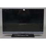 A Sony “Bravia” 31” LCD television with remote control.