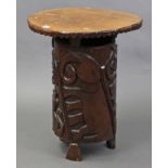 An Eastern-style occasional table with circular top, & on carved cylindrical centre column, 19½”