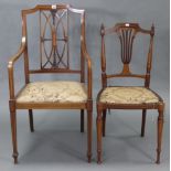 An Edwardian inlaid-mahogany elbow chair with pierced lattice back, padded seat, & on square tapered