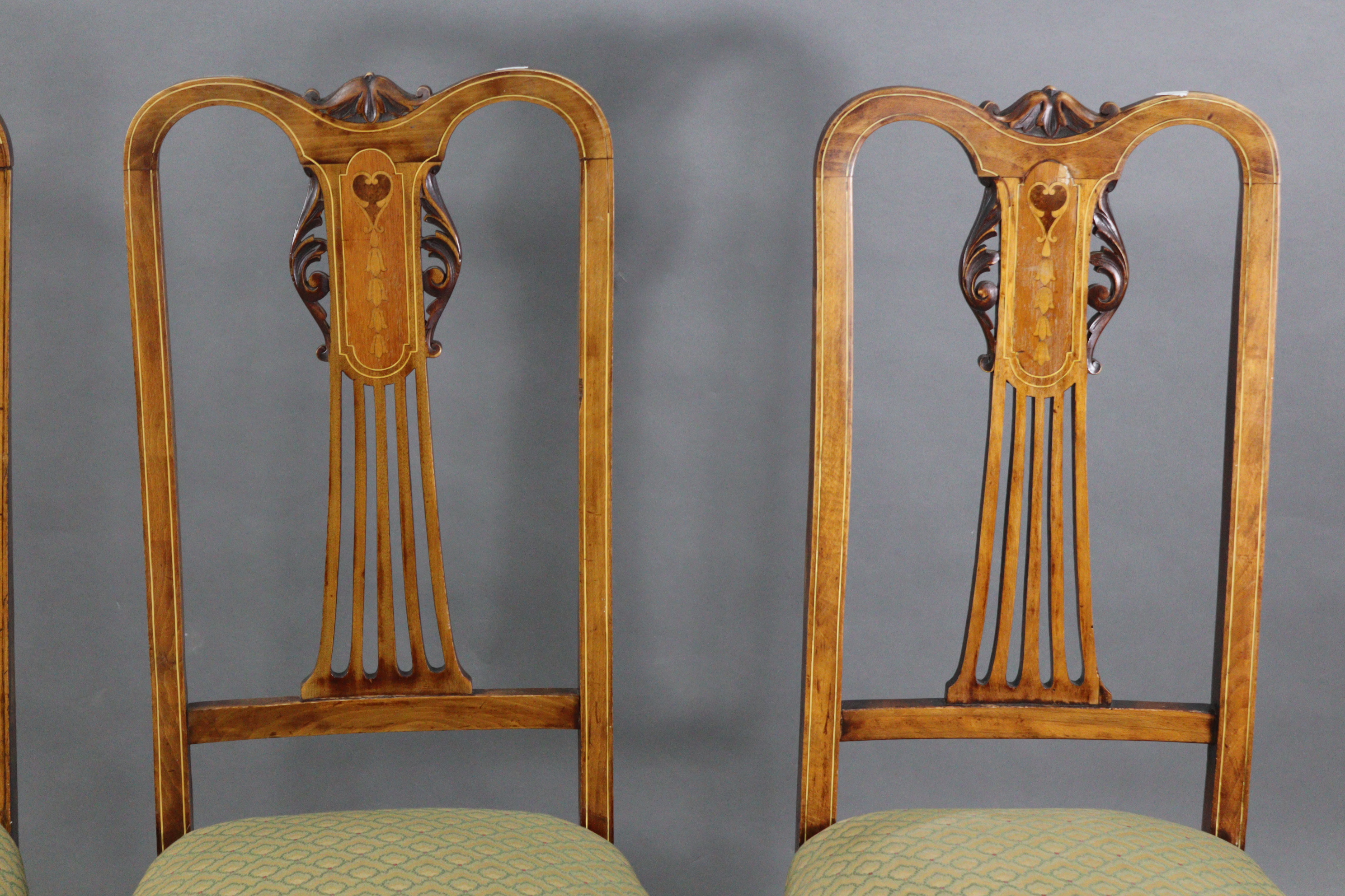 A set of four Edwardian inlaid-beech splat-back dining chairs with padded seats, & on slender - Image 3 of 4