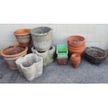 Twenty-two various flower pots & garden troughs; & a pair of wicker hanging baskets.