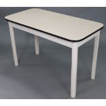 A white Formica top rectangular kitchen table, the white painted underside with four square legs,