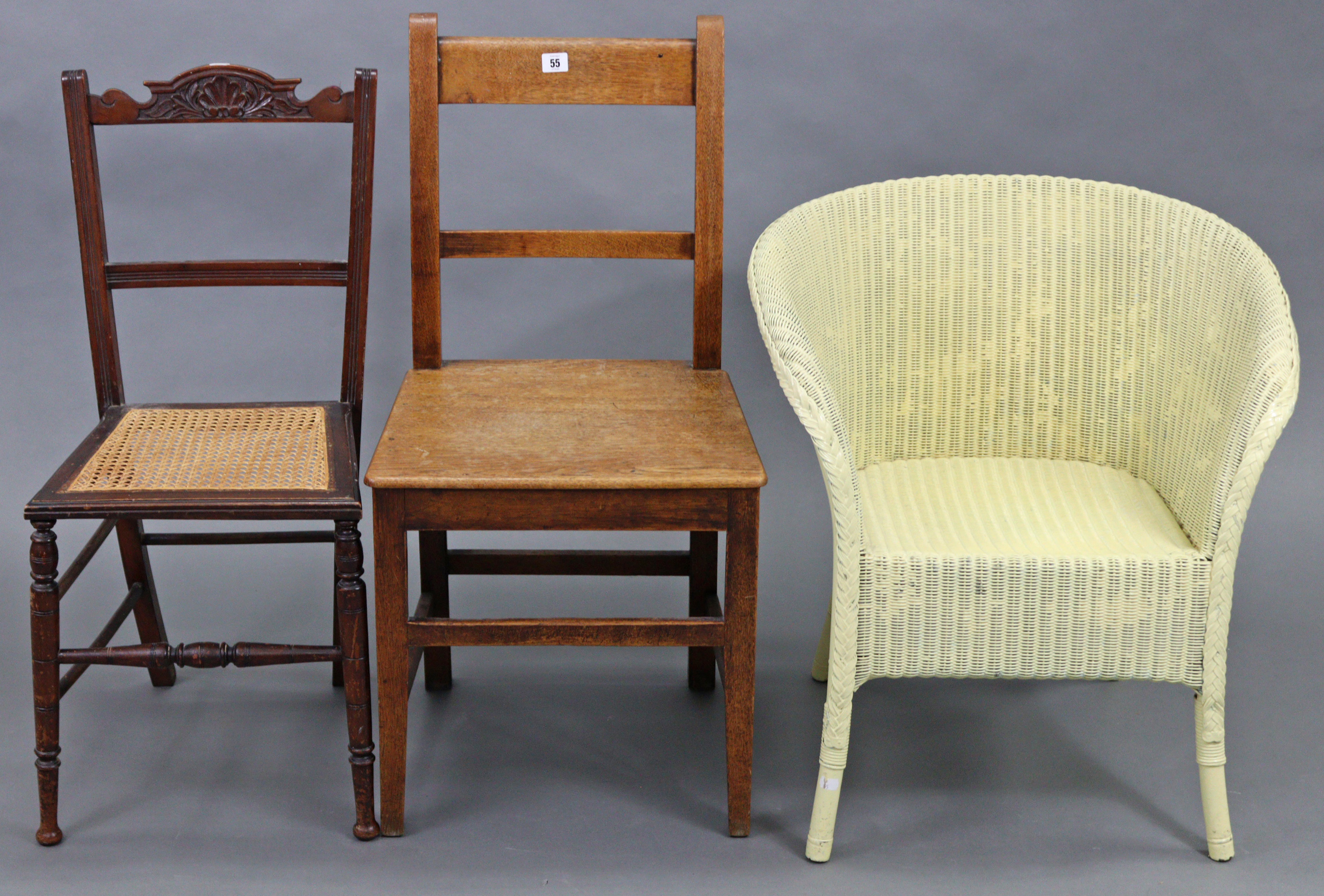 An oak rail-back cottage dining chair, with hard seat & on square tapered legs with plain