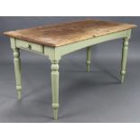 A pine kitchen table with moulded edge to the rectangular top, the painted underside fitted with