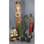 A painted & carved wooden Buddha ornament, 22” high; a pair of temple-dog ornaments, 10” high; &