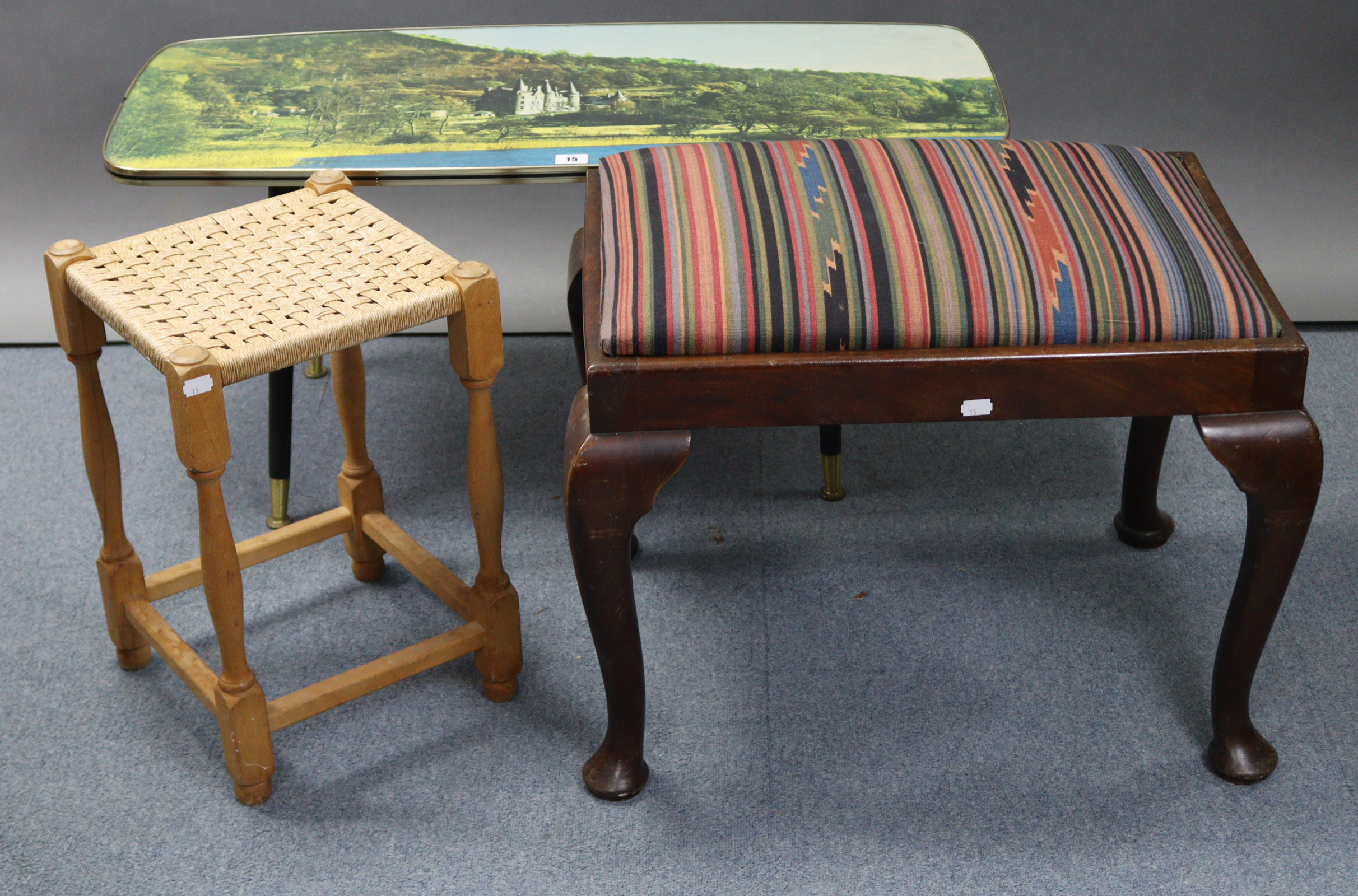 A retro-style rectangular low coffee table, 35½” wide x 16” high; together with two stools.