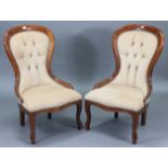 A pair of Victorian-style spoon-back easy chairs each with sprung seat & buttoned-back upholstered