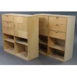 A pair of plywood side cabinets, each fitted with an arrangement of drawers, cupboards, & open