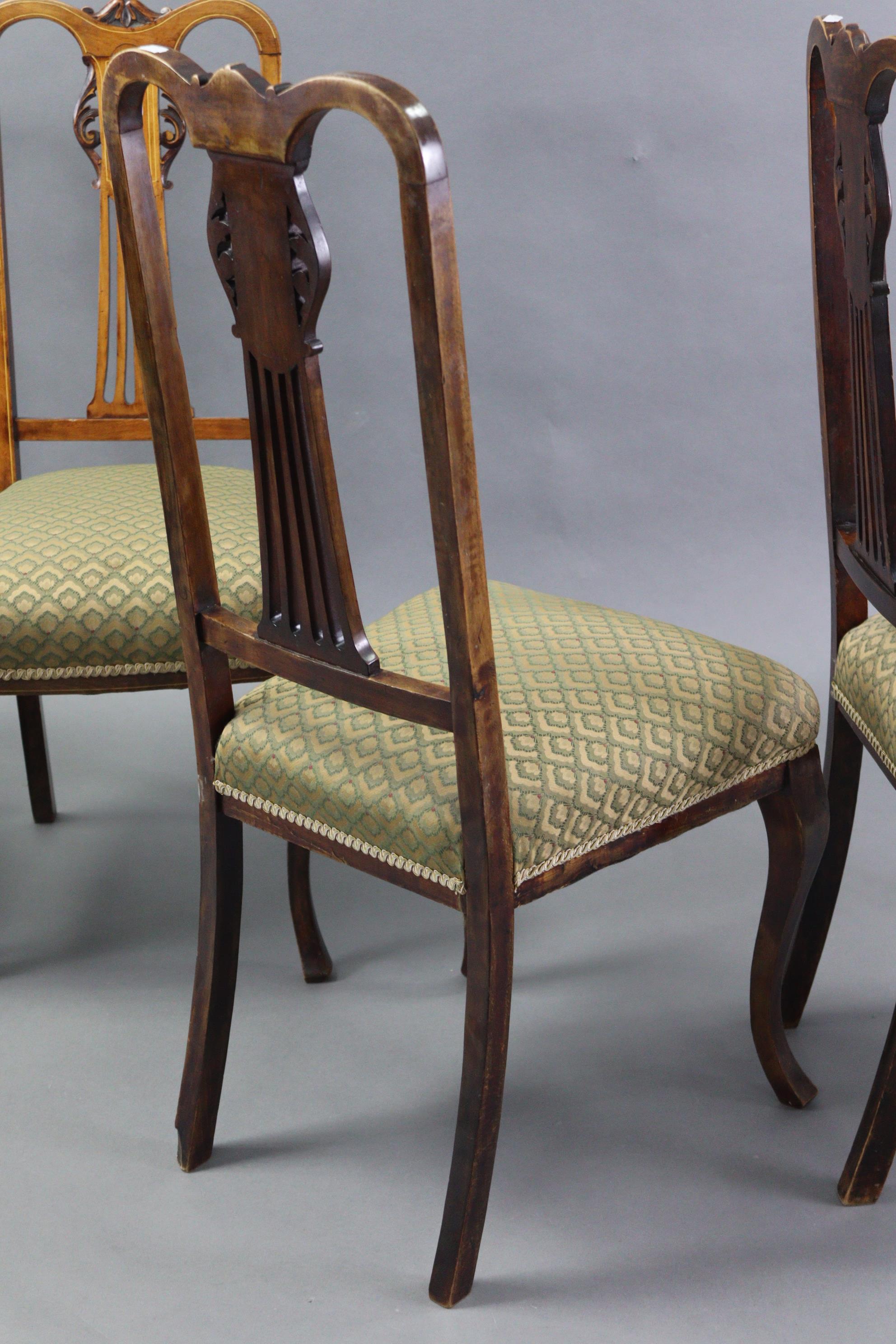 A set of four Edwardian inlaid-beech splat-back dining chairs with padded seats, & on slender - Image 4 of 4