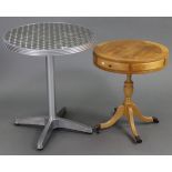 A silvered-metal finish kitchen table with circular top, & on round centre column & four splay legs,