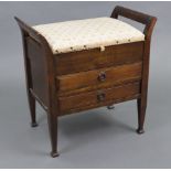 An Edwardian beech piano stool with padded hinged seat above two long drawers with hinged