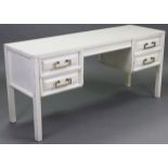 A 1970’s white painted mahogany knee-hole dressing table fitted four drawers, & on square legs,