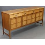 A teak sideboard, fitted three frieze drawers above three cupboards, & on short square tapered