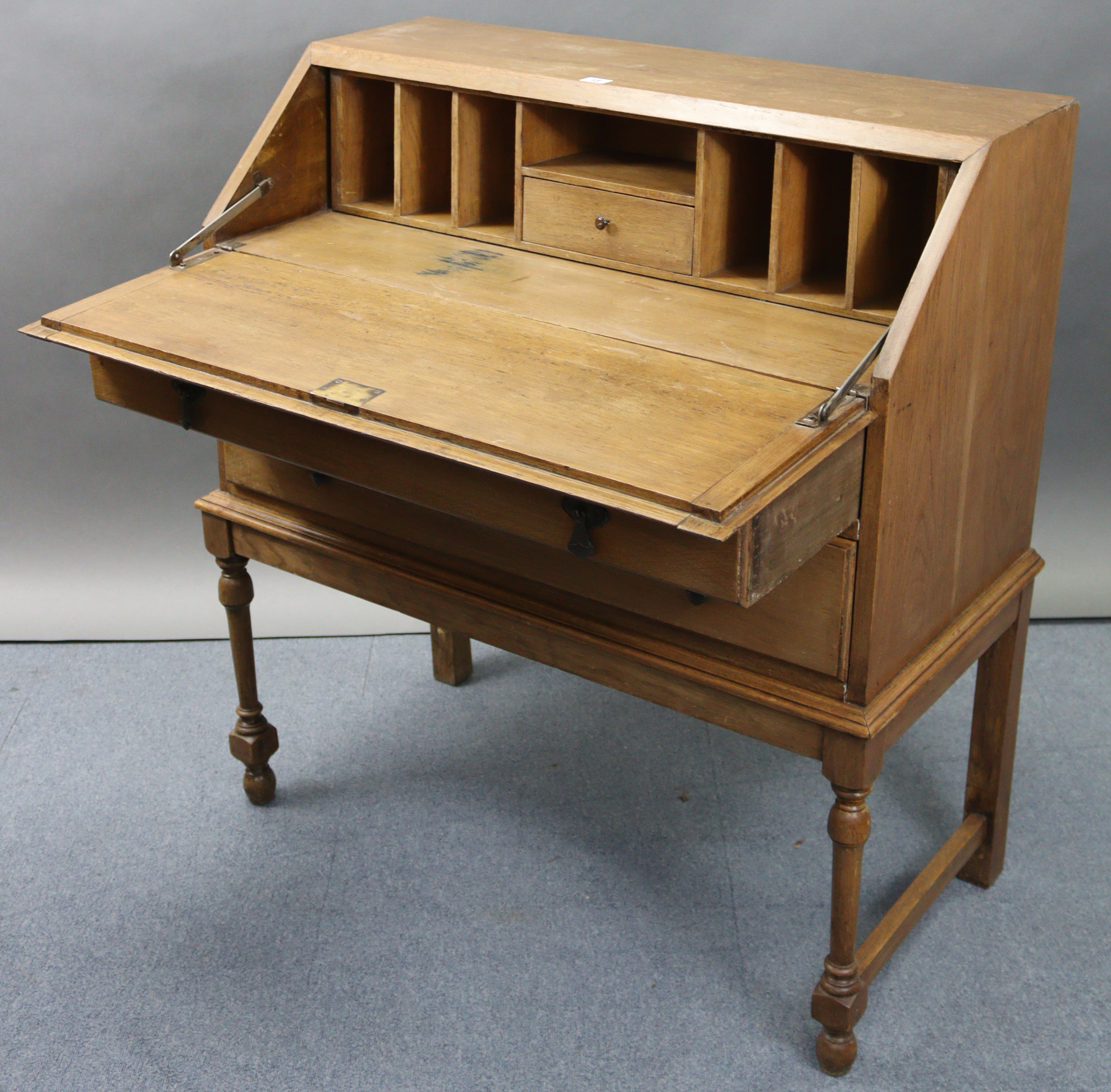 An early/mid-20th century oak bureau with fitted interior enclosed by fall-front above two long - Image 2 of 7