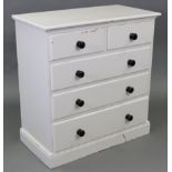 A white painted pine chest fitted two short & three long graduated drawers with turned knob handles,