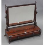 A 19th century mahogany rectangular swing toilet glass, with turned supports & fitted two cushion-