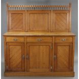 A Victorian oak Aesthetic-style sideboard with spindle-rail to panelled stage back, the base