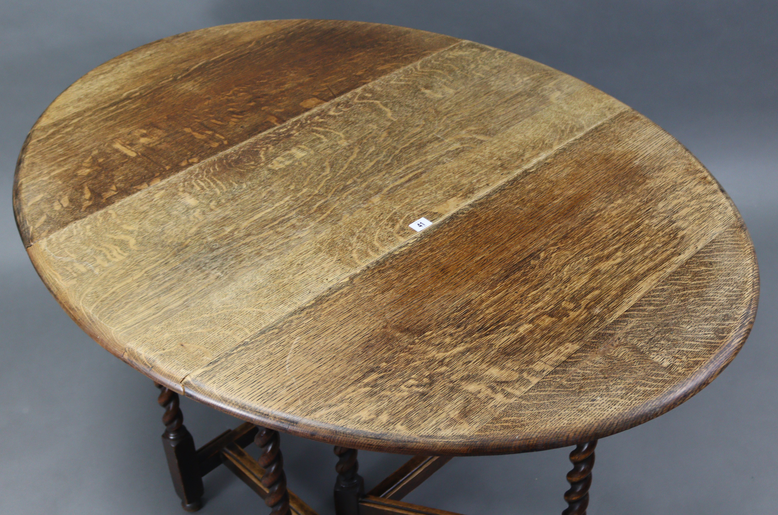 A 1930’s oak oval gate-leg dining table on barley-twist legs & turned feet with plain stretchers, - Image 3 of 3