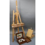 A Mabef beech artist’s fold-away studio easel, 75½” high; an artist’s paintbox/easel; & various