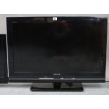 A Sony “Bravia” 30” LCD television with remote control; a Hitachi 26” colour television, lacking