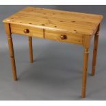 A pine side table fitted two frieze drawers, & on turned legs, 35” wide; & a laminate rectangular