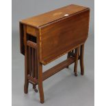 An Edwardian inlaid-mahogany Sutherland table, with canted corners to the rectangular top & on