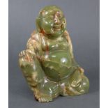 A carved green onyx model of a seated Buddha, 8” high x 6½” wide.