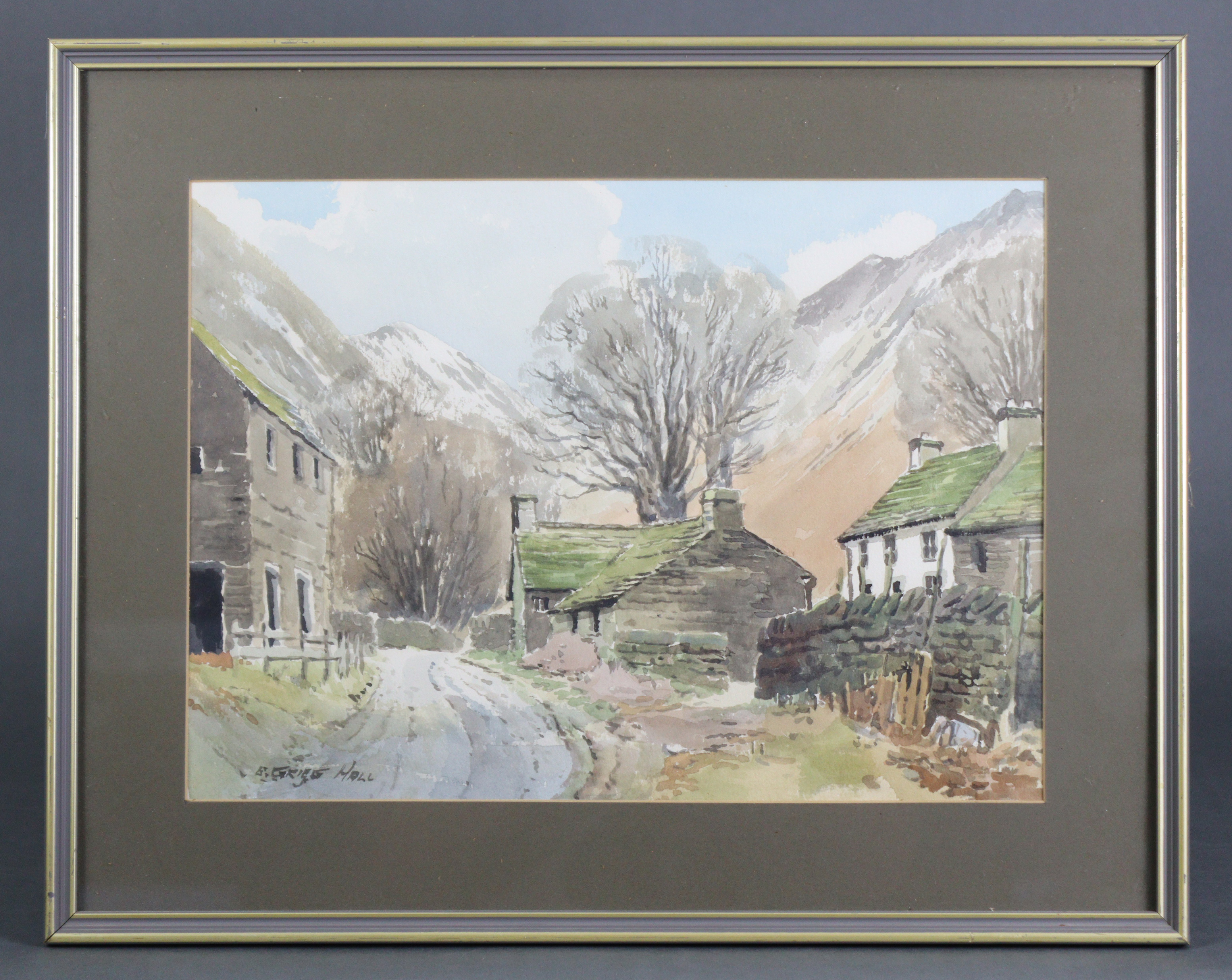 E. GRIEG HALL (British, 20th century). A mountainous rural landscape with country road & cottages to