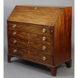 A George III mahogany bureau, the sloping fall-front enclosing fitted interior inset gilt-tooled