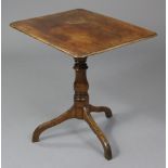 An early Victorian mahogany & oak tripod table with moulded edge to the rectangular top, on