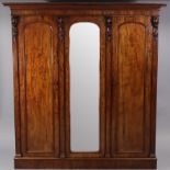 A Victorian mahogany wardrobe, a full-length hanging compartment to the right, the centre & left wi