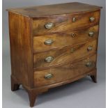 A George III mahogany bow-front chest, with moulded edge to the overhang top, fitted four long