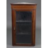 A late Victorian inlaid mahogany hanging corner display cabinet, fitted two shelves enclosed by