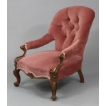A mid-Victorian mahogany easy chair with padded buttoned back & open arms, overstuffed seat, & on