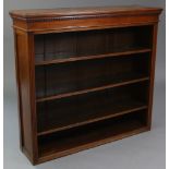 A Victorian mahogany standing open bookcase, with moulded dentil cornice above three adjustable