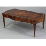 A reproduction inlaid mahogany coffee table on shaped rectangular outline, inset gilt-tooled leather