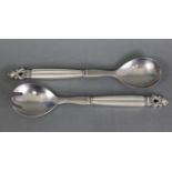 A pair of Georg Jensen Danish sterling silver “Acorn” pattern serving spoons with fluted stems &