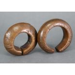 Two African tribal bronze monetary currency bangles, each with incised decoration, 3½” diam.