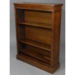 A Victorian mahogany & rosewood standing open bookcase with moulded edges & fluted pilasters, fitted