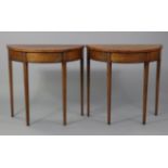 A pair of George III style inlaid mahogany demi-lune side tables of small proportions, each with