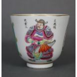 A Chinese porcelain wine cup painted in famille rose enamels with figures & panels of calligraphy,