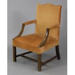 An early 20th century George III style mahogany armchair with shaped padded back & open arms,