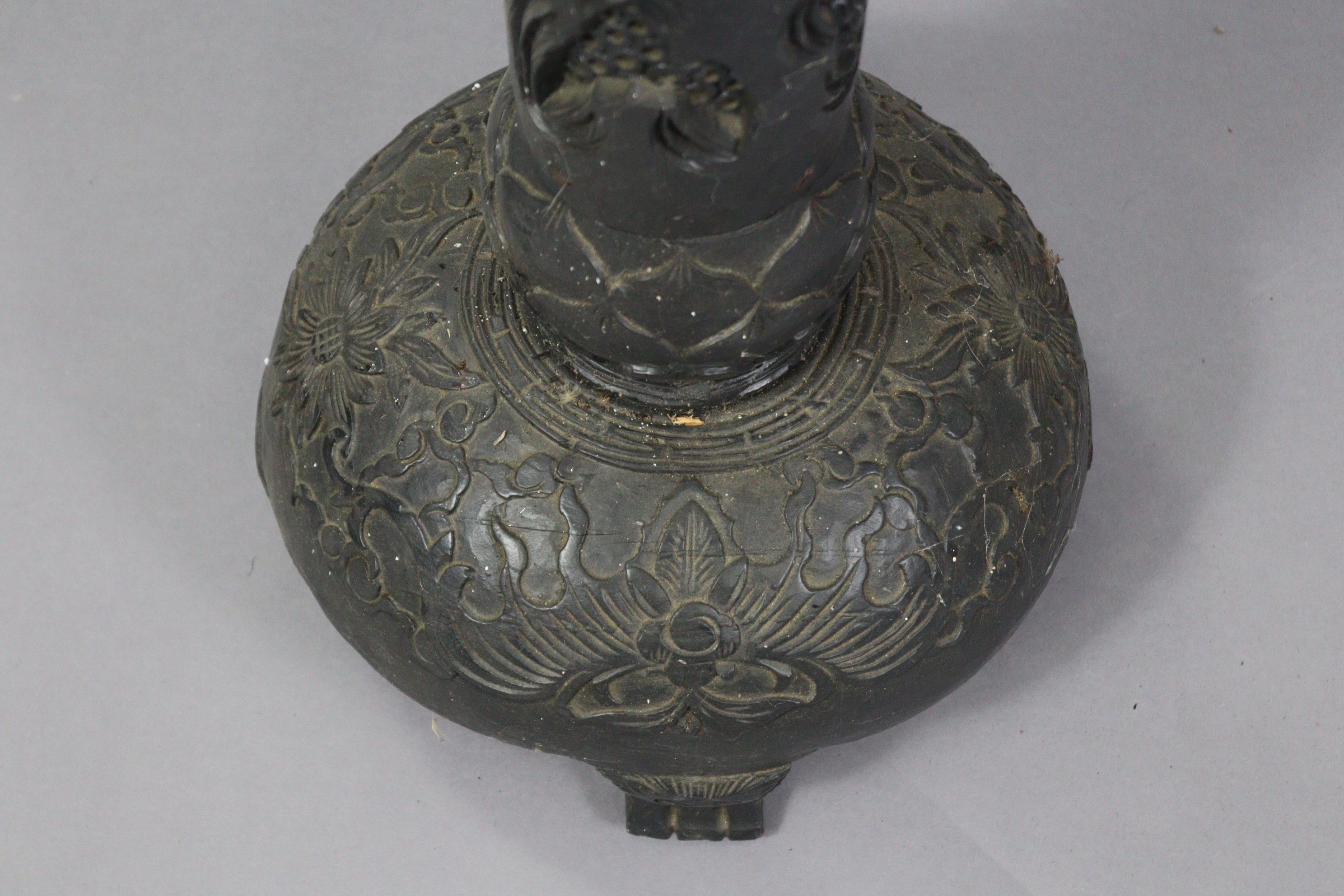 An early 20th century eastern carved & pierced ebonised wooden torchere/standard lamp, the - Image 2 of 7