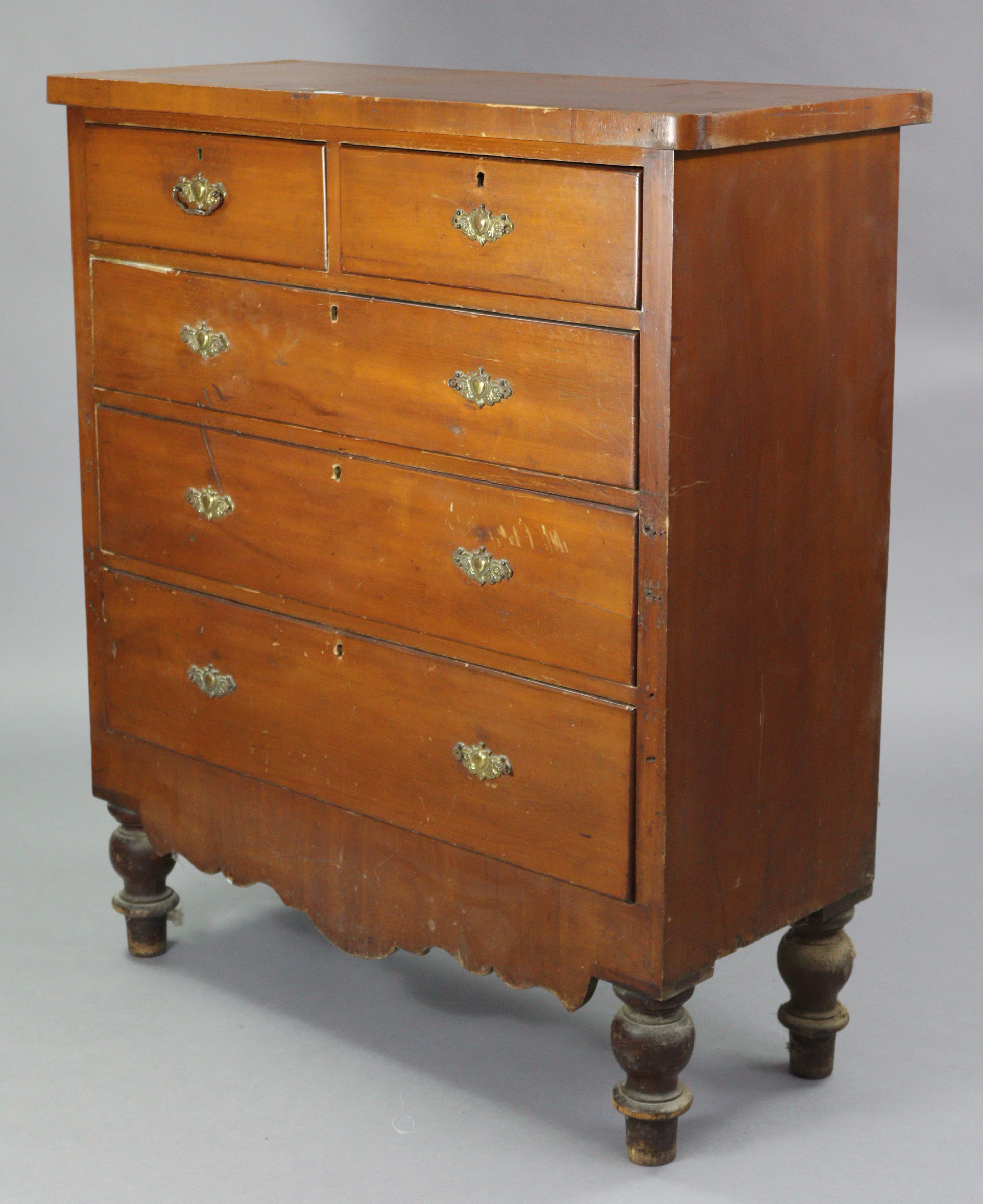 A late Victorian walnut chest fitted two short & three long graduated drawers, with shaped