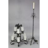 A black-finish wrought-iron eight branch chandelier with scroll-arms & fitted with crackle glass