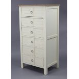 A modern upright white-finish chest fitted six long drawers & with natural oak top, 25½” wide x 49½”