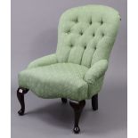 A Victorian-style buttoned-back easy chair, upholstered pale green geometric material & on short